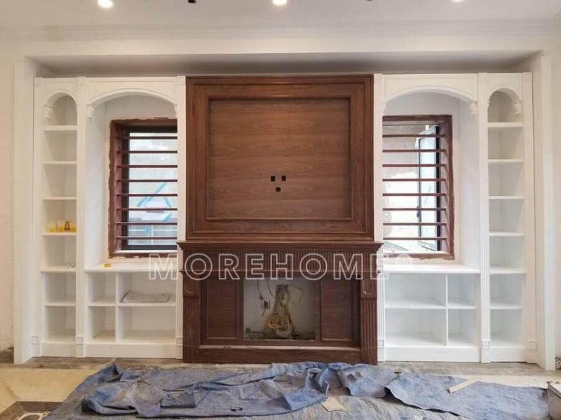 Hoàn thiện mẫu lò sưởi giả bằng gỗ óc chó cao cấp giúp nâng tầm không gian sống .